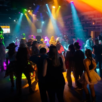 Crowd line dancing at PBR Cowboy Bar at Live! at the Pointe Orlando.